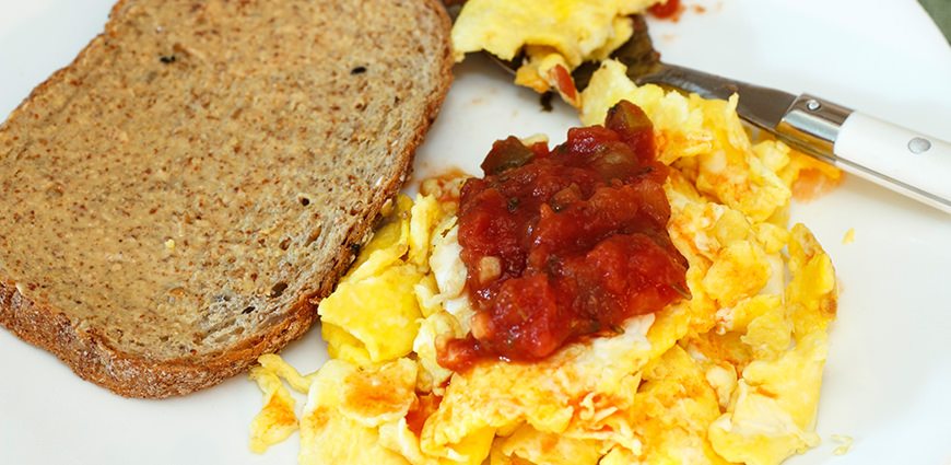 Eggs, salsa and toast breakfast